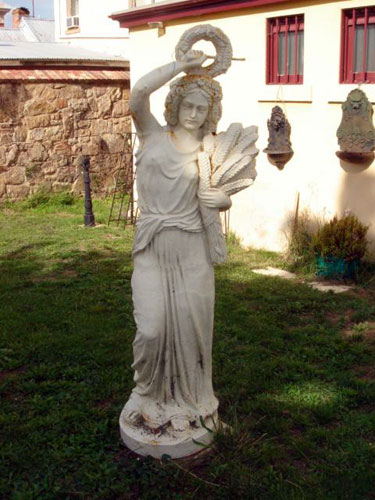 Large cast iron maiden with wheat